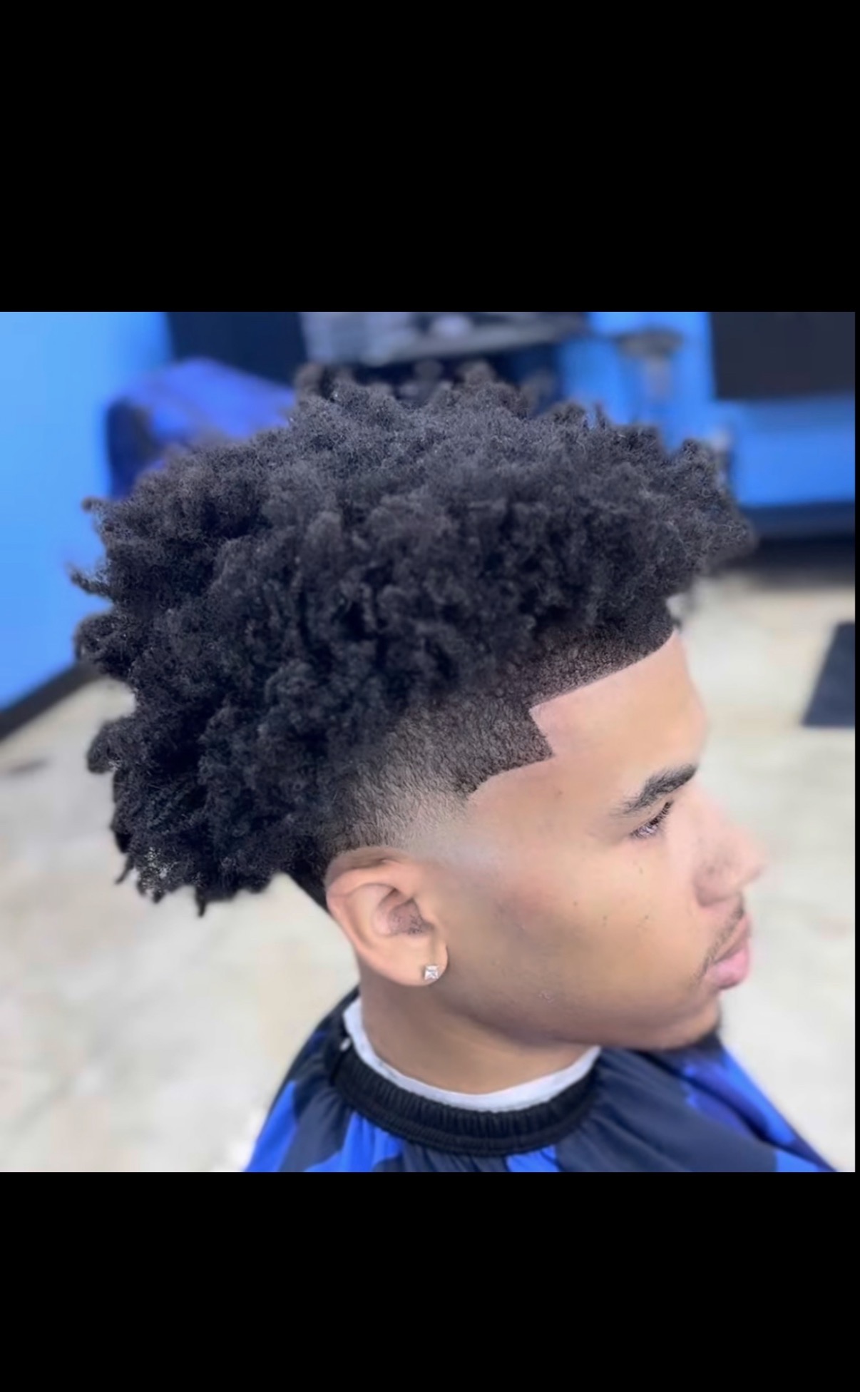 Textured afro with low taper fade
